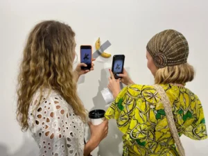 A Bite Out of Controversy: The Latest Twist in Cattelan’s Comedian Saga